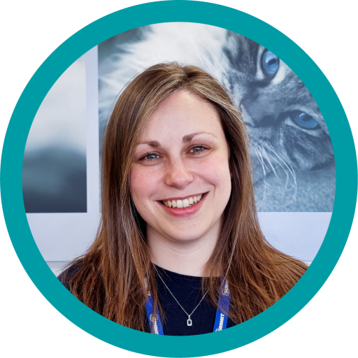 This is a photograph of Rachel Bell. She has brunette hair and is smiling at the camera.